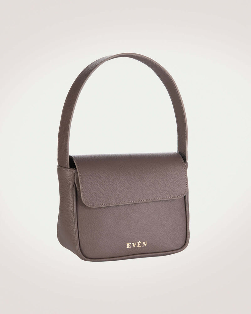 A brown leather mini handbag with a sleek and minimalist design, featuring a small brand logo.