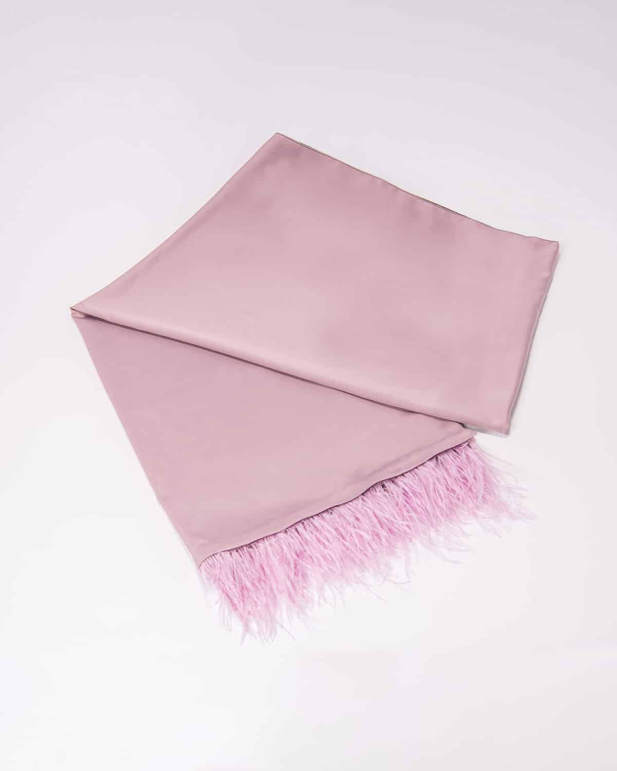 Soft pink satin Eride scarf, a delicate and luxurious accessory that adds a feminine touch to any outfit. Perfect for adding a pop of color with elegance.