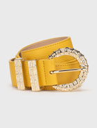 Yellow belt with a decorative gold buckle on a light gray background