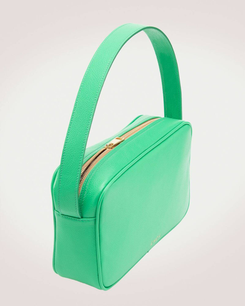 Rhea messenger bag in green leather by even-online with gold tone zipper.