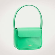 Luisa mini green leather handbag with a sleek and minimalist design, featuring a gold tone brand logo on the front.