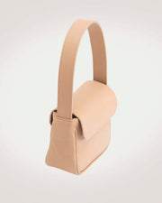 Side view of mini beige color leather handbag. Made in EU