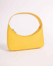 Zoe yellow calf leather mini bag with a curved zip closure and a brand logo visible on the bottom corner.