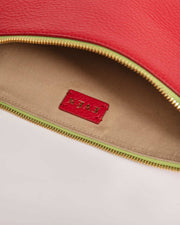 Inside shot of Leyza Clutch in red leather 'EVEN' logo.