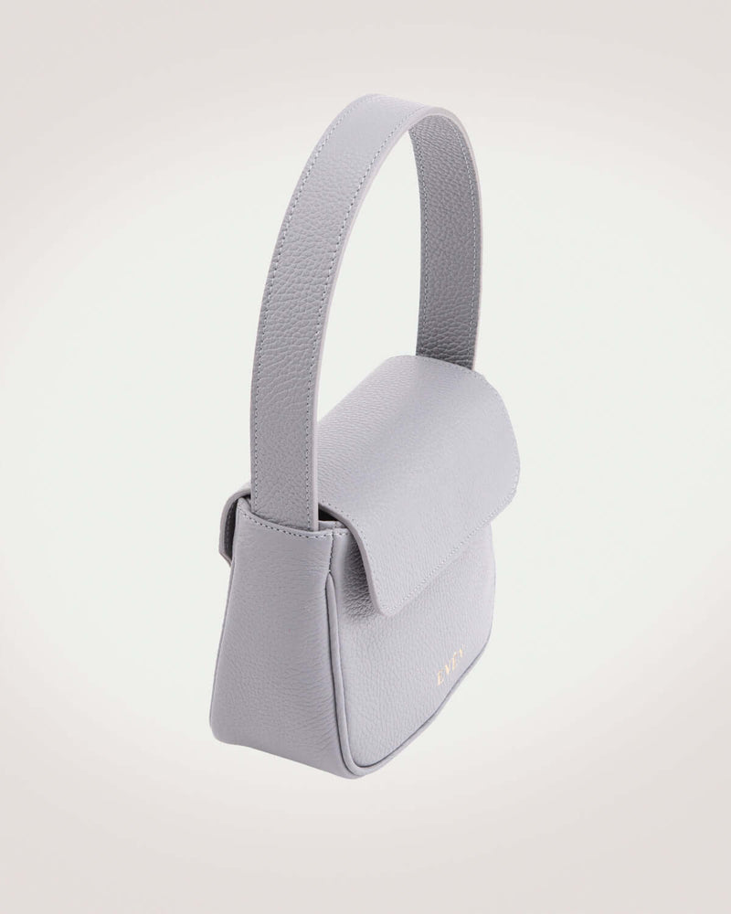 Luisa mini bag in grey leather crafted by even-online with gold tone logo in front. 