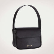 A black mini bag with a sleek and minimalist design, featuring a single handle and a brand logo 'EVEN' embossed on the front. Made in EU