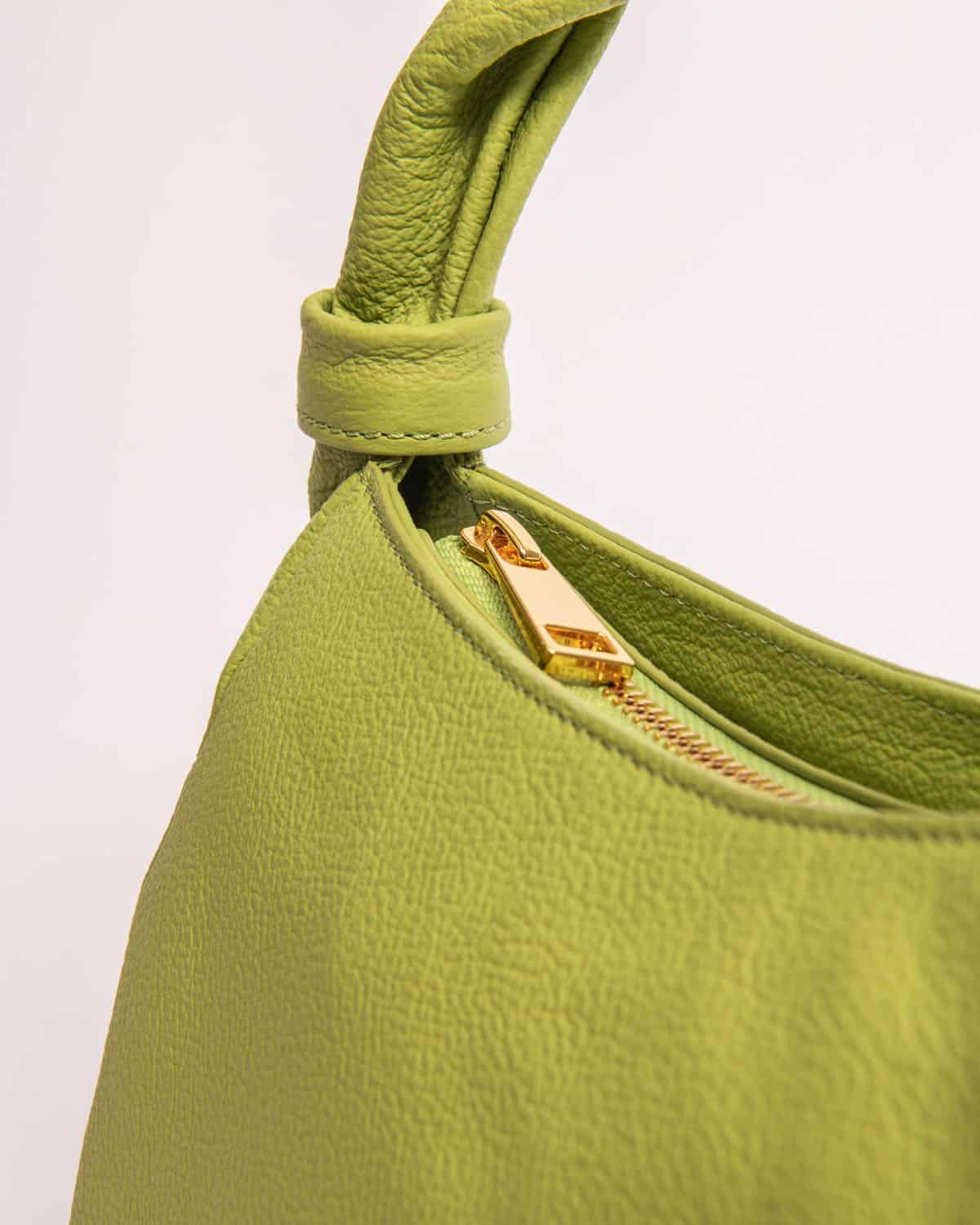 Monna mini tote bag in light green genuine leather with gold tone zipper by EVEN brand.