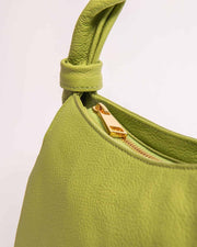 Monna mini tote in green view of handle and gold zipper