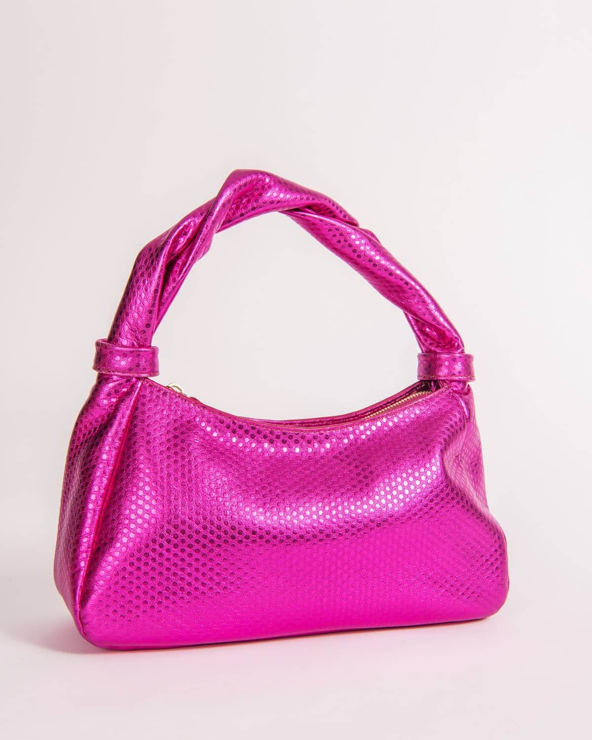 Pink Monna handbag with textured surface on a light pink background