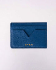A dark blue calfskin leather cardholder with multiple card slots, displayed on a white background.