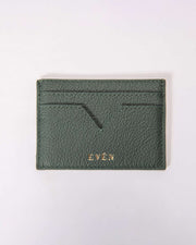 A petrol blue Muzi cardholder made from premium calfskin leather, displayed on a white background.