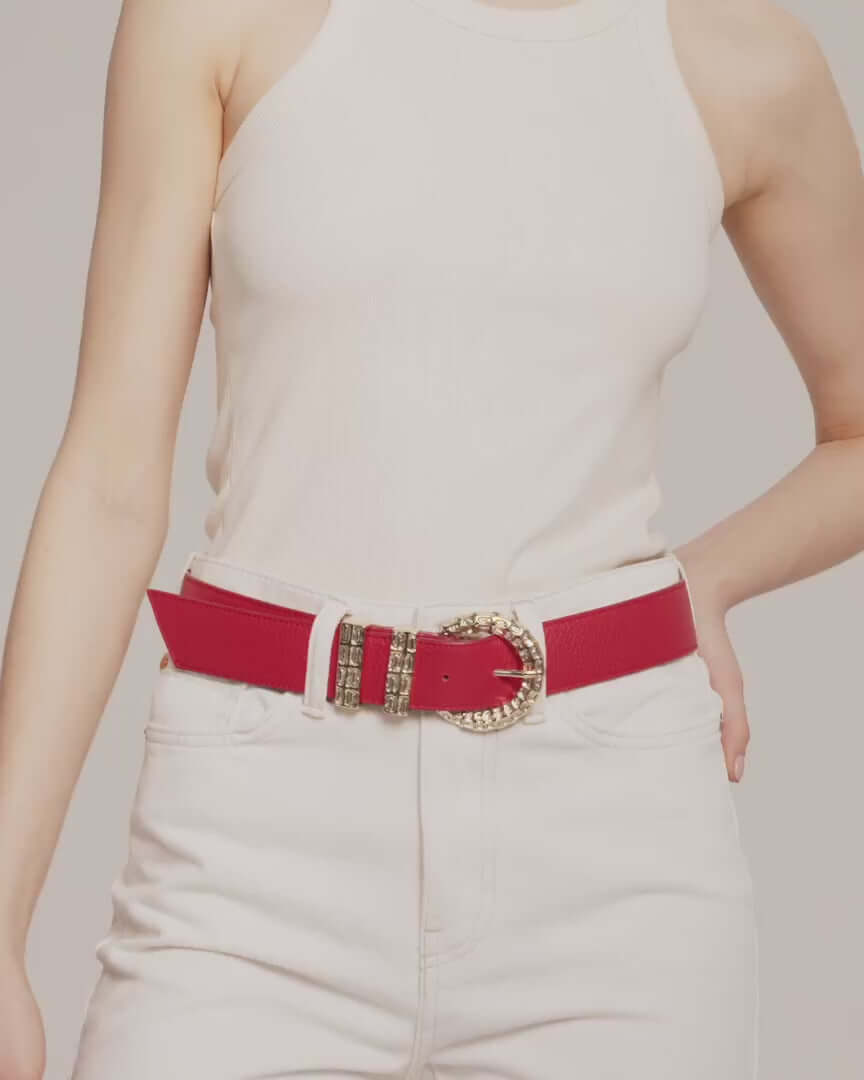model is wearing white pants with erini belt in red leather with gold tone buckle by even online