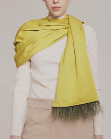 model is wearing erida scarf in olive and dark olive feathers