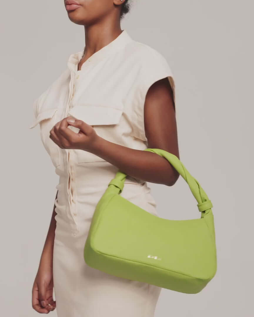 Model showing Monna light green leather handbag by even-online
