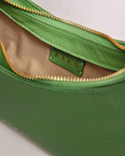 Zoe Mini Baguette Bag in green leather with gold-tone zipper and chic short strap – luxury designer handbag for women.
