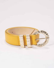 A yellow leather Erini belt with an ornate gold-colored buckle, displayed against a white background.