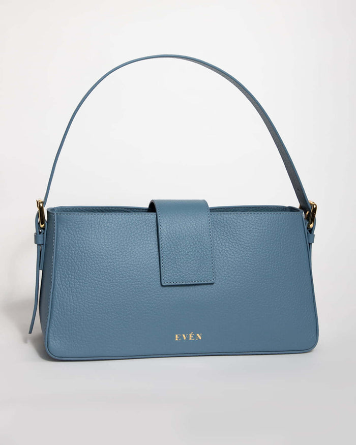Belona blue sky colored calfskin leather hobo bag with an adjustable shoulder strap and a magnetic clasp, displayed against a neutral background.