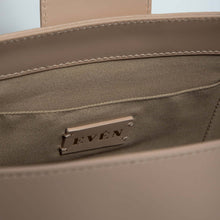 Interior view of BELONA Hobo Bag by Even-online, showcasing premium calfskin leather and branded tag.