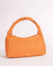 MONNA orange leather mini tote bag with a triangular shape and gold hardware, displayed against a plain background.